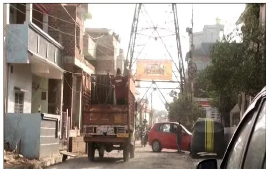 High tension electricity tower in the middle of the road Bhopal.