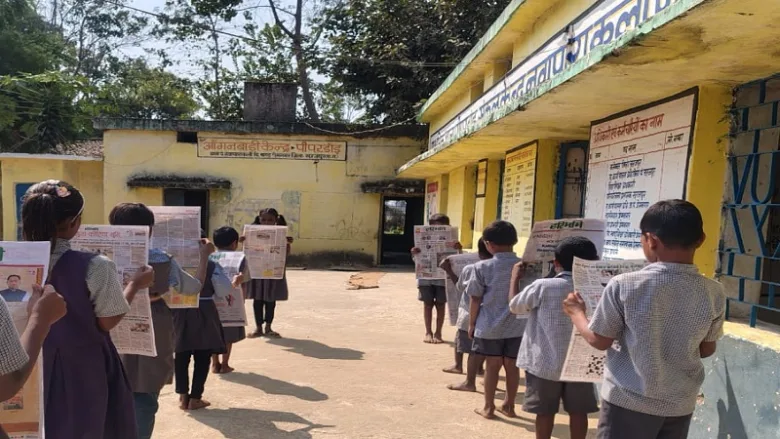 Children reading newspaper at Govt School Piperdand Sarguja.