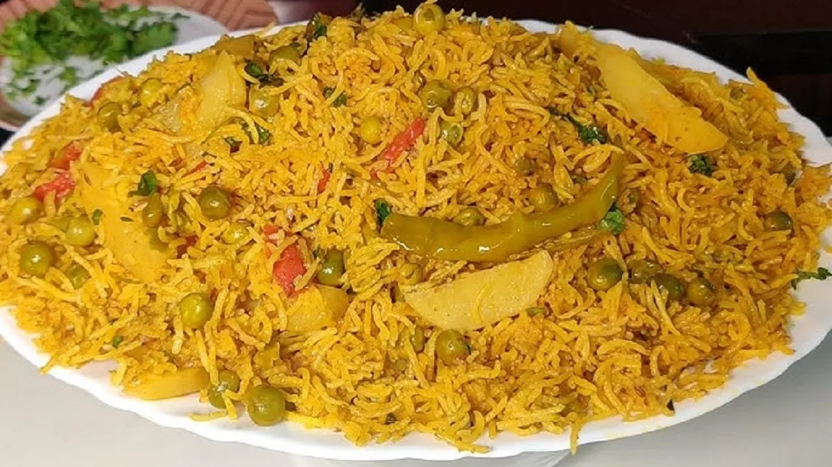 Hot and delicious traditional Indian tahri served in a bowl with fresh coriander