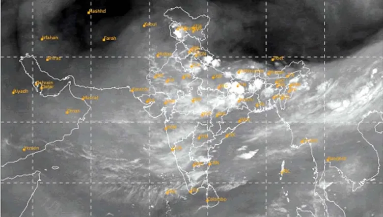 Weather satellite image of Indian subcontinent covered with dense monsoon clouds viewed from space.