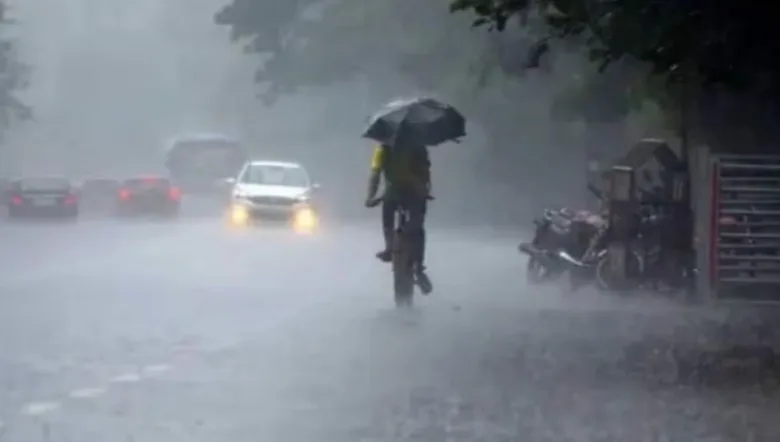 Heavy rain falling on wet city roads in Raipur Chhattisgarh with dark monsoon clouds above.