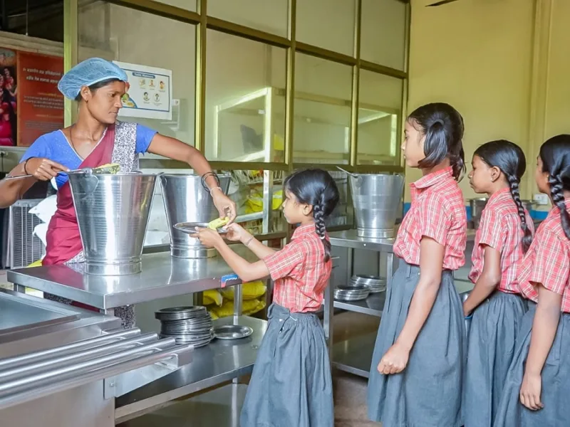 Rural mothers providing fresh vegetables for school meals in Surguja Chhattisgarh