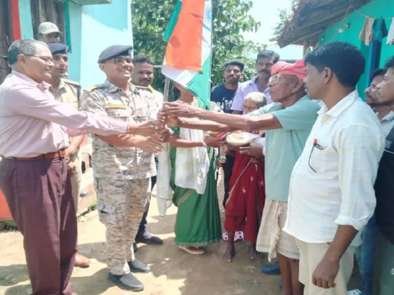 Officials honoring martyr family with national flag during Har Ghar Tiranga campaign in Naxal free Bijapur