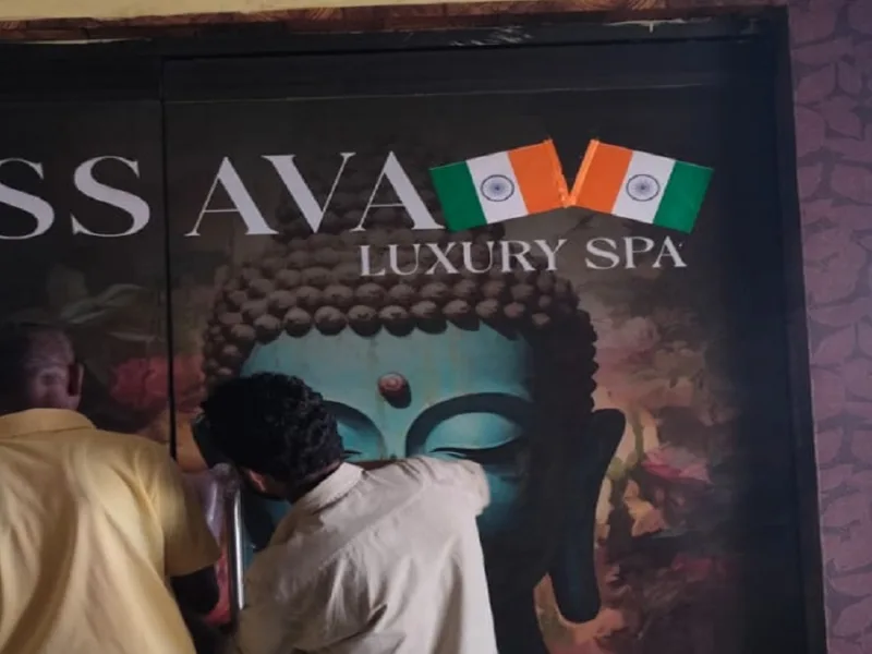 Police team conducting raid and investigation outside Ishwa Luxury Spa Center in Devendra Nagar Raipur.