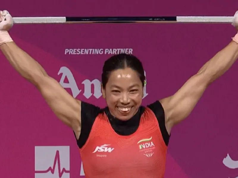Mirabai Chanu posing with her silver medal at the Asian Games